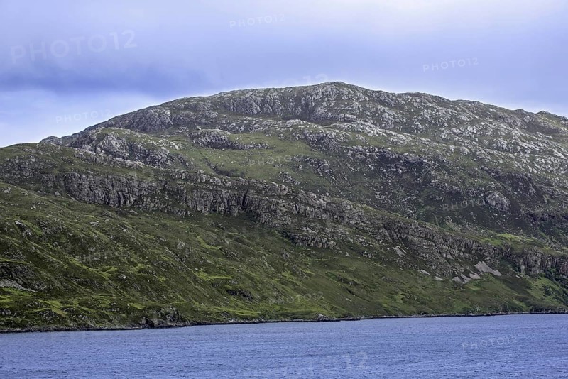 Glencoul Thrust on the Aird da Loch peninsula showing Cambrian quartzite sandwiched between layers of Lewisian gneiss in Scotland