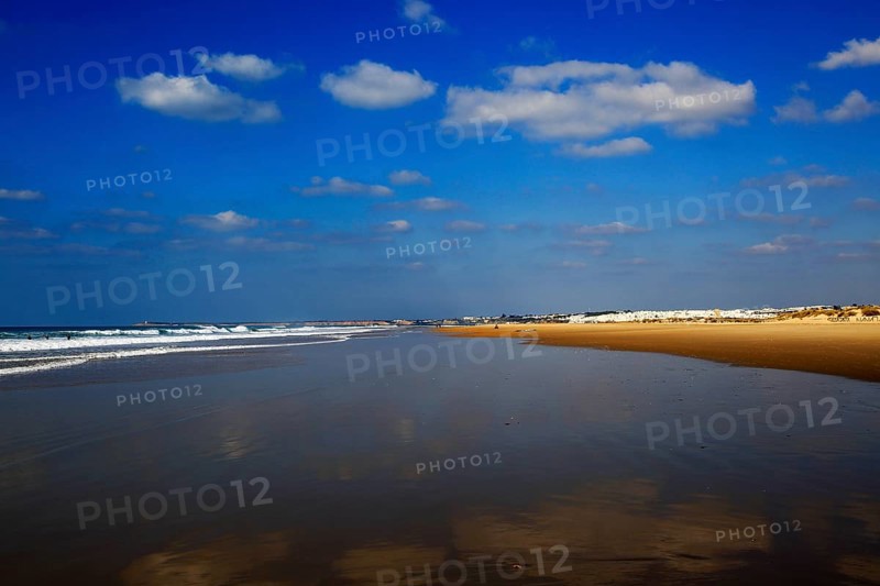 Wave breaking on sandy beach at Conil de la Frontera, Cadiz Province, Spain, Europe
