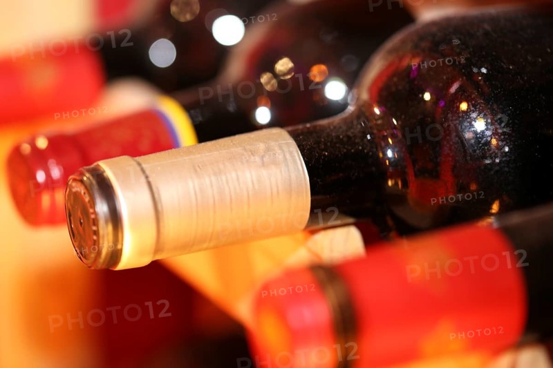 Wine cellar with red wine bottles