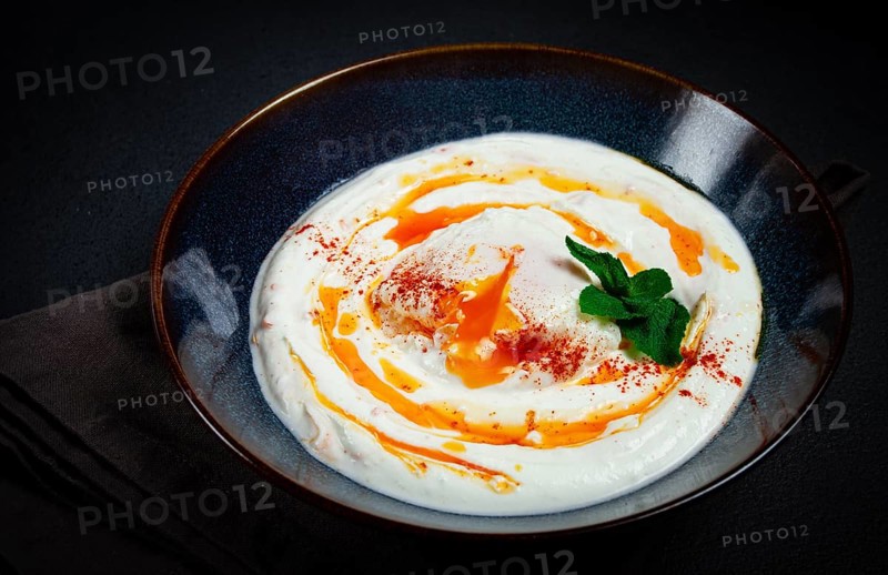 Cilbir, traditional Turkish breakfast, Turkish eggs with yogurt and butter, homemade, no people