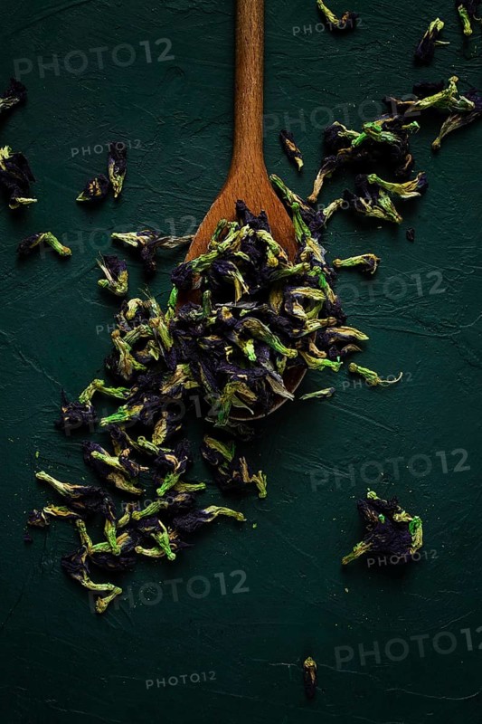 Thai, blue tea, butterfly pea tea, Anchan, wooden spoon, on a dark table, top view