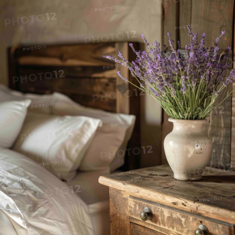 Lavender flowers (Lavendula) in a vase on a bedside table next to a bed, rustic, rural ambience, AI generated, AI generated, AI generated