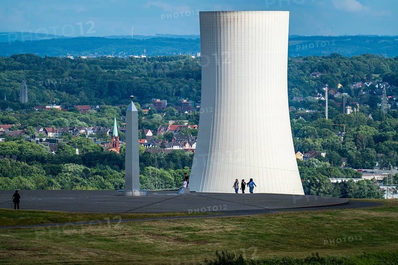 Cooling tower of the STEAG combined heat and power plant in Herne and the obelisk of the sundial, on the Hoheward spoil tip, the largest spoil tip in the Ruhr area, between Herten and Recklinghausen, North Rhine-Westphalia, Germany, Europe
