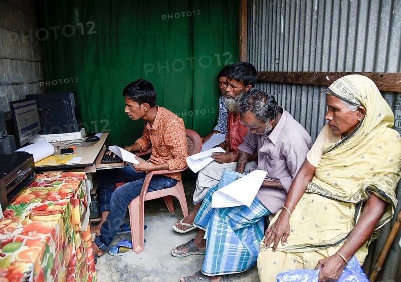 People checks their names in a roadside DTP centre, in the published final list of National Register of Citizens (NRC), in Morigaon district of Assam, India on 31 August 2019