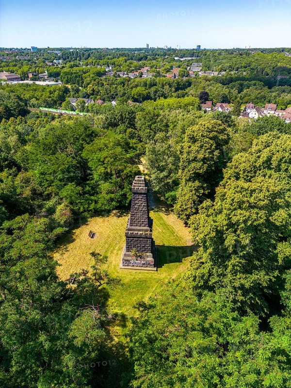 The Mechtenberg in Essen, one of the few natural elevations from the ice age in the Ruhr area, was once 100 metres above sea level, but due to mining subsidence it is now only around 80 metres above sea level, Bismarck Column, view to the west towards Essen, part of the Mechtenberg Landscape Park, North Rhine-Westphalia, Germany, Europe