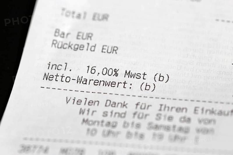 Close-up of a till receipt showing the reduction in VAT to sixteen per cent in Germany due to the coronavirus crisis