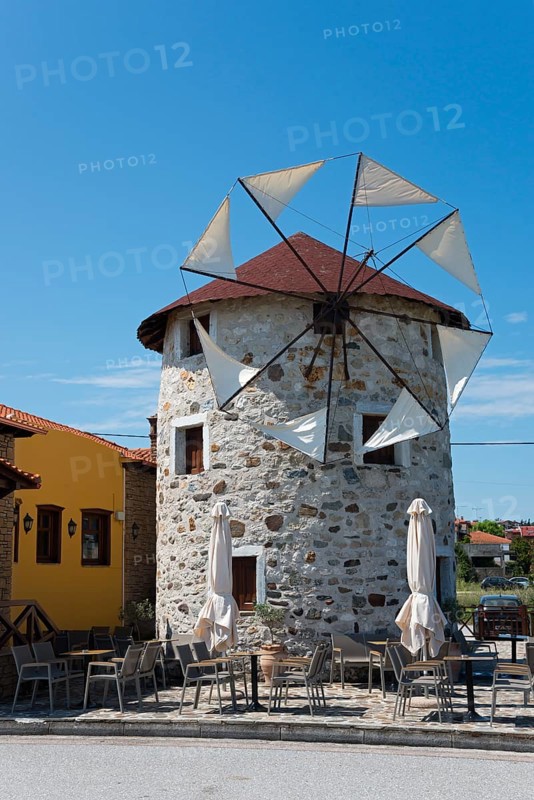 Traditional windmill converted into a café under a clear blue sky, Ierissos, Sithonia, Halkidiki, Central Macedonia, Greece, Europe