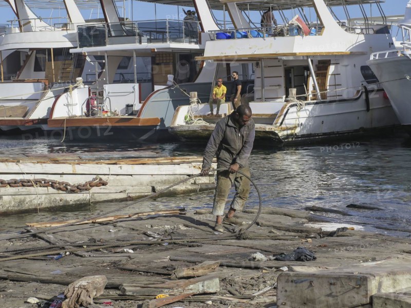 Labourer, boat building and repairs, yacht shipyard, Hurghada, Egypt, Africa