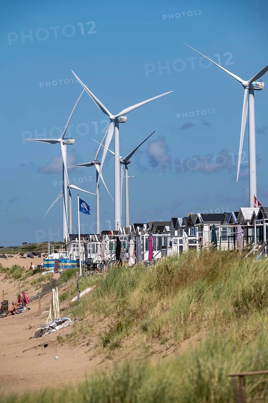 Wind turbines, wind farm, holiday homes, beach houses on the beach of Ijmuiden in North Holland, Netherlands