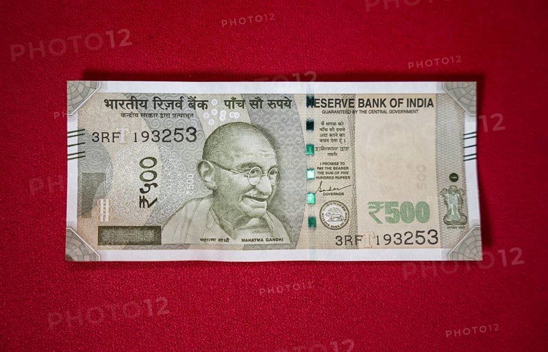 Indian 500 rupee currency bank note on a red background