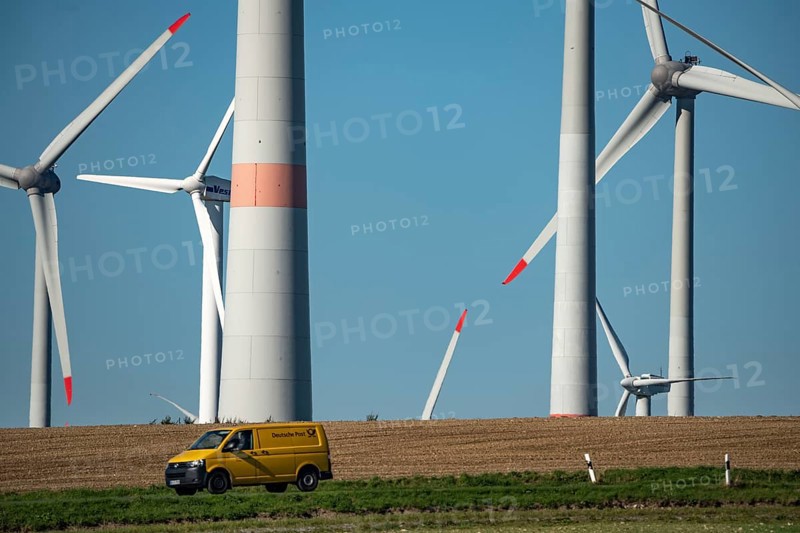 Wind farm near Lichtenau, wind turbines, country road, Driburger Straße, Deutsche Post vehicle, North Rhine-Westphalia, Germany, Europe