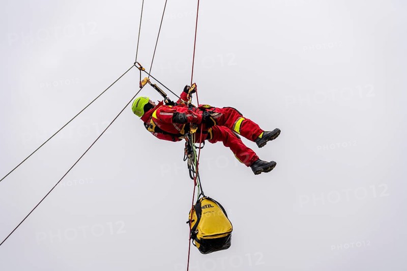 Height rescuers from the Oberhausen fire brigade practise abseiling from a wind turbine from a height of 150 metres after rescuing an accident victim from the nacelle, Issum, North Rhine-Westphalia, Germany, Europe