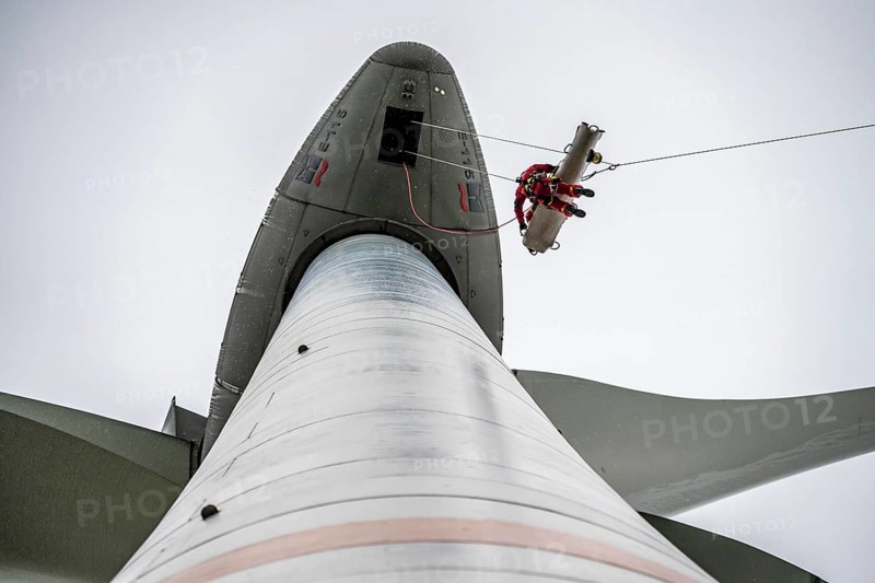 Height rescuers from the Oberhausen professional fire brigade practise abseiling from a wind turbine from a height of 150 metres, rescuing an injured person, technician, from the nacelle, Issum, North Rhine-Westphalia, Germany, Europe