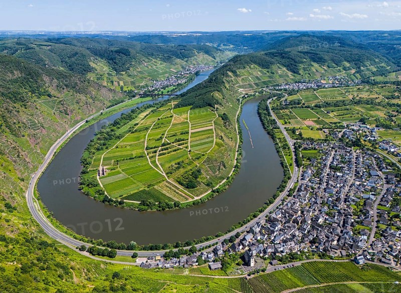 A river bend cuts through a hilly landscape with vineyards and a neighbouring village, surrounded by agricultural land, aerial view, Moselle, Moselle bend, Bremm, Cochem, Cochem-Zell, Rhineland-Palatinate, Germany, Europe