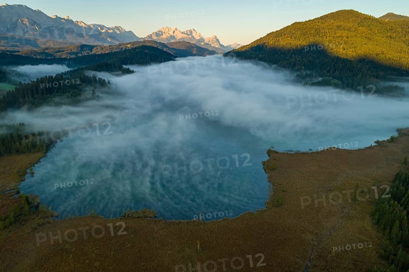 Aerial view of a mountain lake in front of mountains, sunrise, fog, autumn, Barmsee, view of Zugspitze and Wetterstein mountains, Upper Bavaria, Bavaria, Germany, Europe