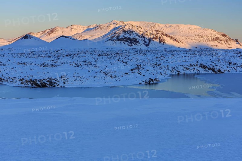 Morning light on a snowy lava field, lake, volcanic crater, snow, winter, Berserkjahraun, Snaefellsnes, Vesturland, Iceland, Europe