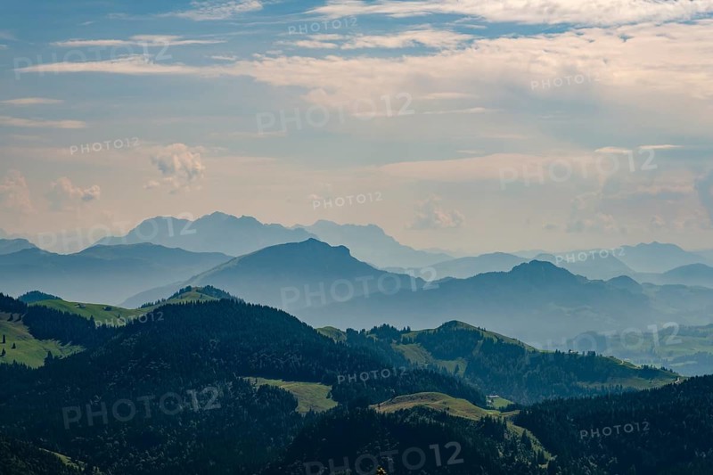 View from the Spitzstein to the silhouettes of the Loferer and Chiemgau Alps, Erl, Tyrol, Austria, Europe