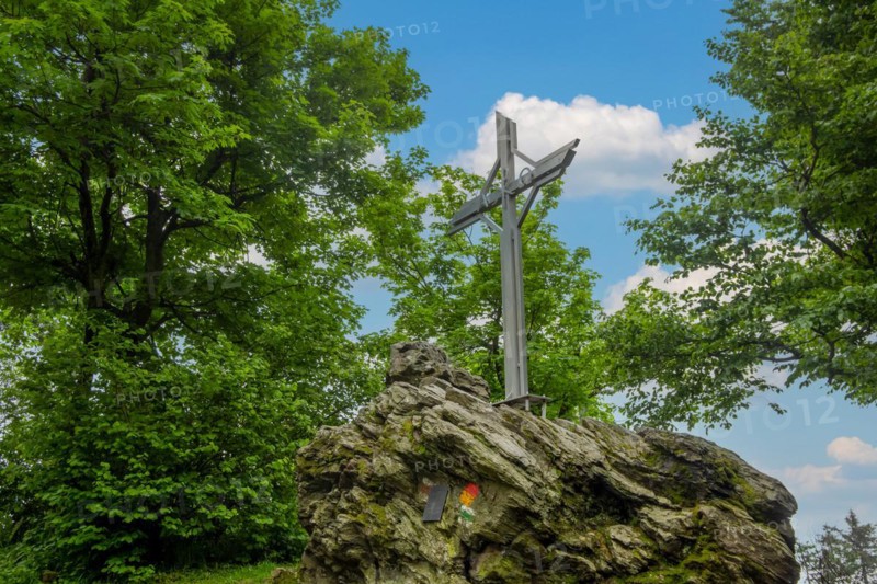Summit cross on the Geschriebenstein in Austria. At 884 metres above sea level, the Geschriebenstein is the highest mountain in Burgenland and western Hungary. It marks the border between Austria and Hungary