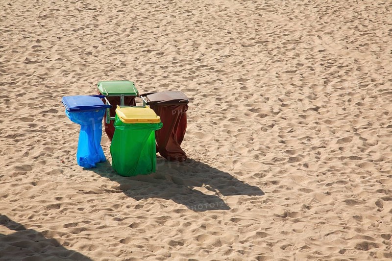 Rubbish bins on the sandy beach