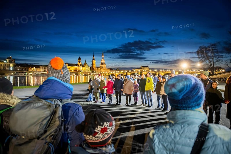 On 13 and 14 February 1945, Dresden was heavily destroyed in three Allied bombing raids. Every year, the people of Dresden commemorate this event at various events. A long human chain symbolised the protection of the city centre. Here looking from the Königsufer across the Elbe to the Old Town, Dresden, Saxony, Germany, Europe