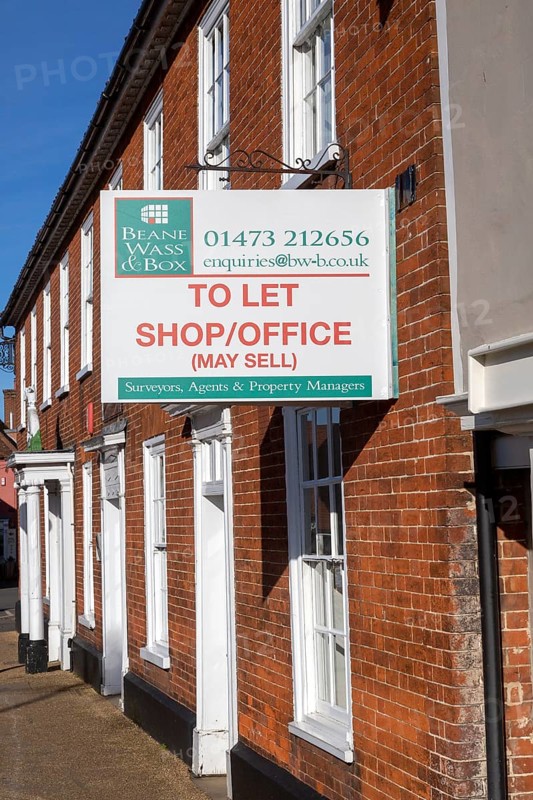 Estate agent commercial property To Let Shop Office sign, Wickham Market, Suffolk, England, UK