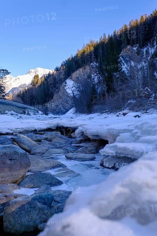 Inn or En near Scuol in winter, with ice floes, Engadin, Grisons, Switzerland, Europe