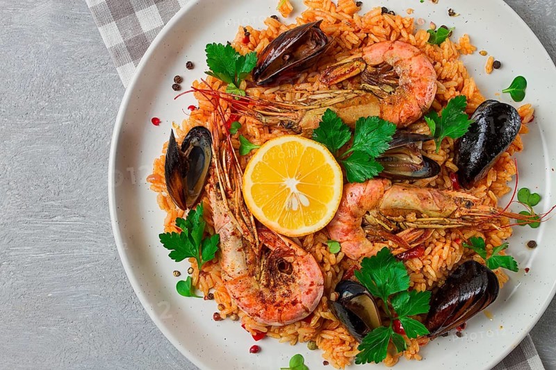 Seafood paella, shrimp and mussels risotto, rice, homemade, top view, no people