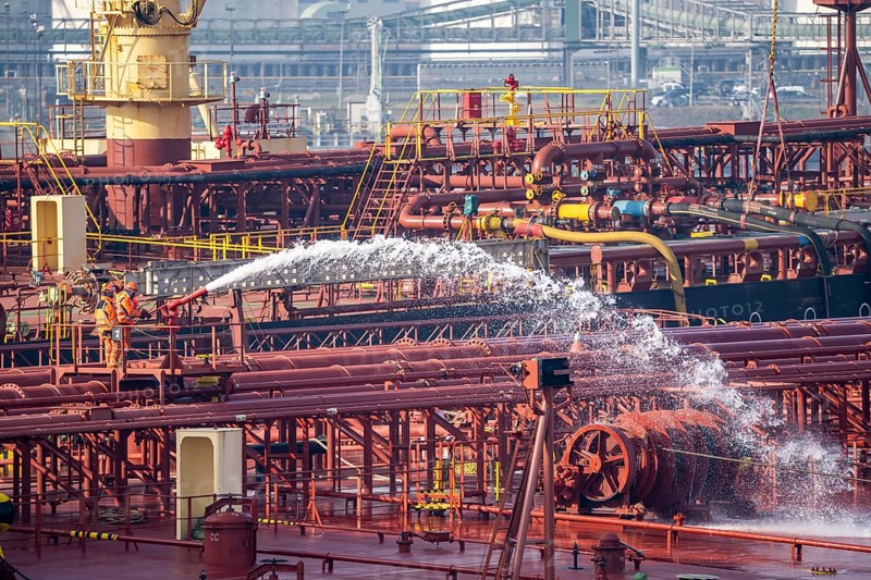The crude oil tanker HOJO, in the seaport of Rotterdam, in the petroleum harbour, Europoort, ship personnel checking the fire extinguishing equipment, pipelines, Rotterdam, Netherlands