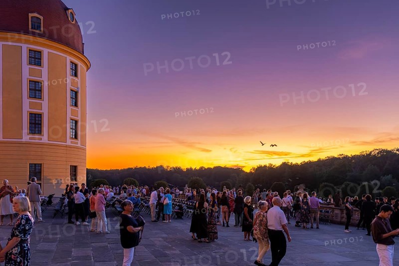 The Moritzburg Festival is an annual chamber music event in Saxony. It was founded in 1993 in Moritzburg by the soloists Kai Vogler, Peter Bruns and Jan Vogler. In Moritzburg, the artists find the ideal setting for the realisation of their musical dreams. The Moritzburg Festival, which has been under the sole artistic direction of cellist Jan Vogler since 2001, has long since established itself internationally as one of the most important festivals for chamber music thanks to its exceptional quality. Here is an evening concert on the north terrace of the baroque palace, Moritzburg Chamber Music Festival, Moritzburg, Saxony, Germany, Europe