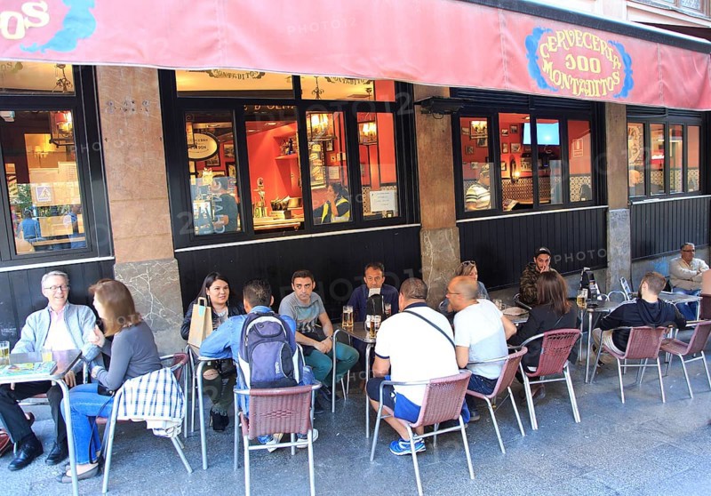 People drinking outside, Cerveceria 100 Montaditos chain bar pub, Madrid city centre, Spain, Europe