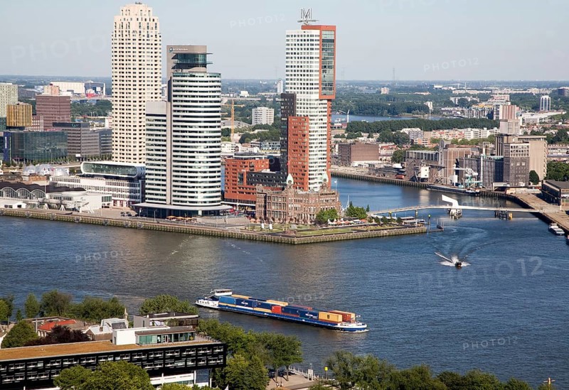 View looking over the city centre from the 185 metre tall Euromast tower, Rotterdam, Netherlands towards Hotel New York surrounded by skyscrapers