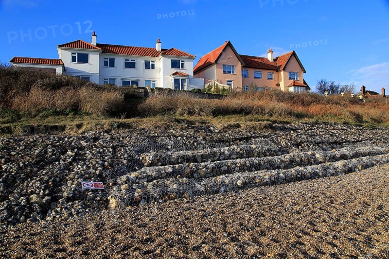 Gabion steel cages containing rocks form coastal defences at Thorpeness, Suffolk, England, UK