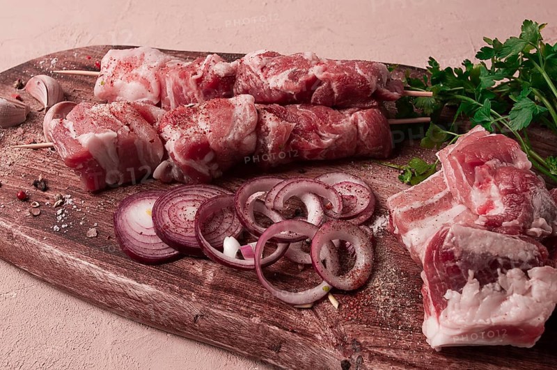 Raw pork meat, on wooden sticks, pickled kebab, with spices, top view, no people