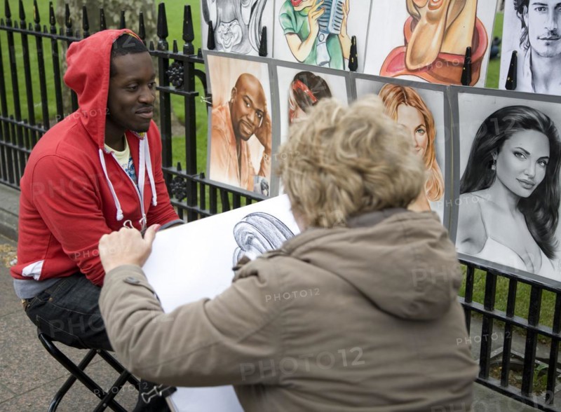 Street portrait artist, Leicester Square, London, England, UK
