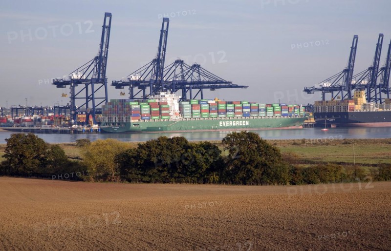Container ships and cranes in the Port of Felistowe, Britain's busiest container port, pictured from across the River Orwell at Shotley, Sufolk, England, United Kingdom, Europe