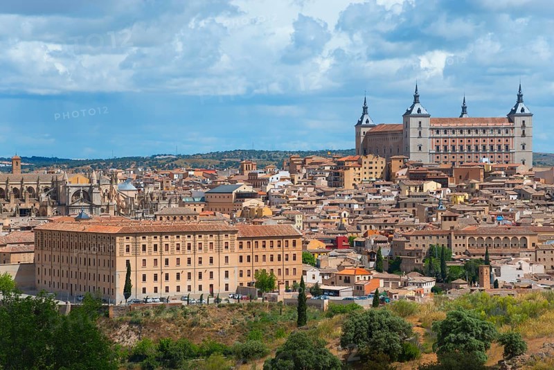 Toledo city view with historic buildings and a cathedral under a blue sky with clouds, Seminario Conciliar de San Ildefonso and Alcázar, Seminary, Alcazar, Toledo, Castilla-La Mancha, Spain, Europe