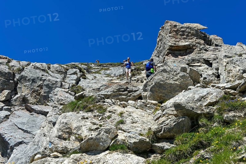Hikers descending from the summit of Pierre Avoi, Valais Alps, Verbier, Valais, Switzerland, Europe