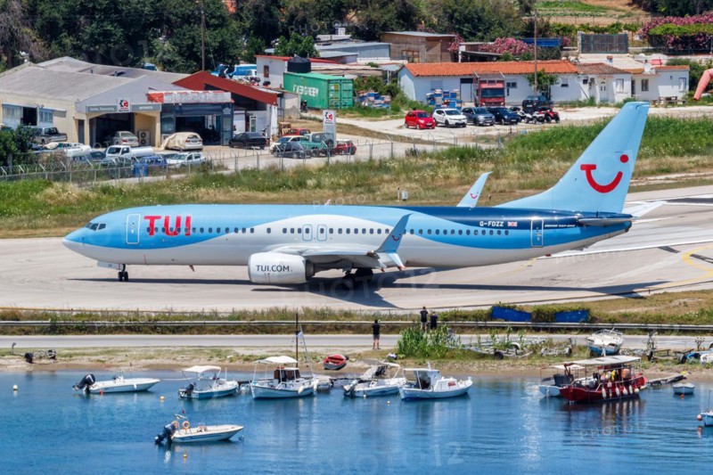 A TUI Airways Boeing 737-800 aircraft with the registration G-FDZZ at Skiathos Airport, Greece, Europe