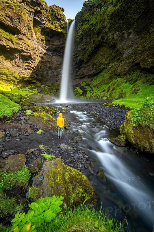 Tourist at Kvernufoss waterfall, in summer when the weather is nice, gorge and river, long exposure, Skogar, Sudurland, South Iceland, Iceland, Europe