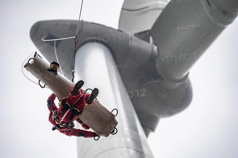 Height rescuers from the Oberhausen professional fire brigade practise abseiling from a wind turbine from a height of 150 metres, rescuing an injured person, technician, from the nacelle, Issum, North Rhine-Westphalia, Germany, Europe