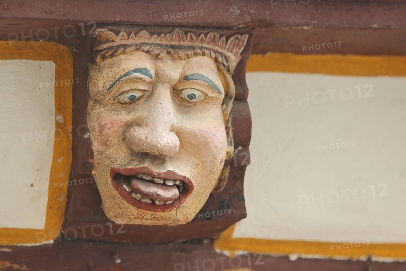 Wood carving with envious head symbolising gluttony, excess, intemperance, face, tongue, nose, eyes, grimace, allegory, allegory, detail, wooden figure, House of the Seven Vices, Brückenstraße, Old Town, Limburg, Hesse, Germany, Europe