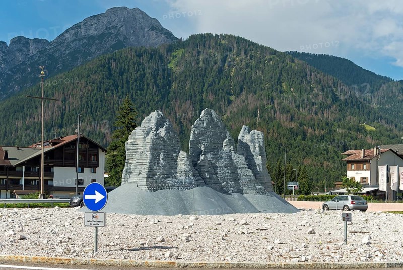 Sculpture The Pale Mountains in the shape of the Three Peaks by Paul S. Feichter and Albert Willeit. Dobbiaco roundabout, South Tyrol, Trentino-Alto Adige, Italy, Europe