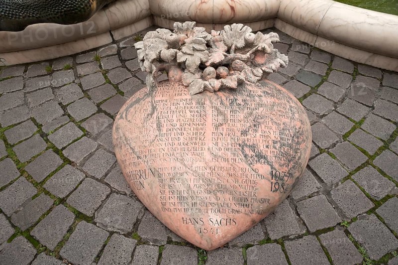 Heart with a poem by Hans Sachs, 1541, in front of the fountain Ehekarussel by Jürgen Weber, erected 1984, Nuremberg, Middle Franconia, Bavaria, Germany, Europe
