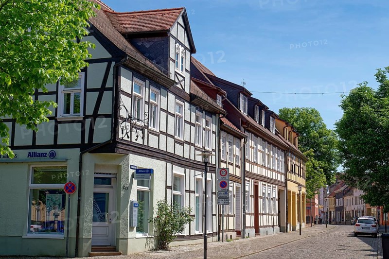 Residential and commercial buildings in Nicolaistraße, paved with cobblestones, in the old town centre of Gardelegen in the Altmark. Hanseatic town of Gardelegen, Saxony-Anhalt, Germany, Europe