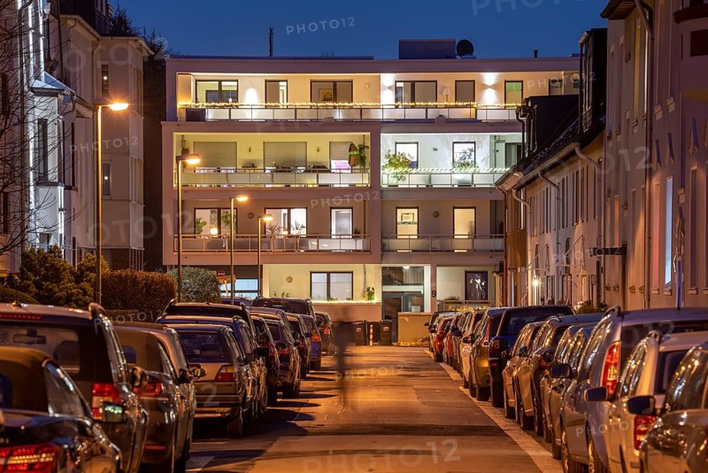 Residential street, many apartment buildings in a residential neighbourhood, evening, lantern lighting, Essen, North Rhine-Westphalia, Germany, Europe