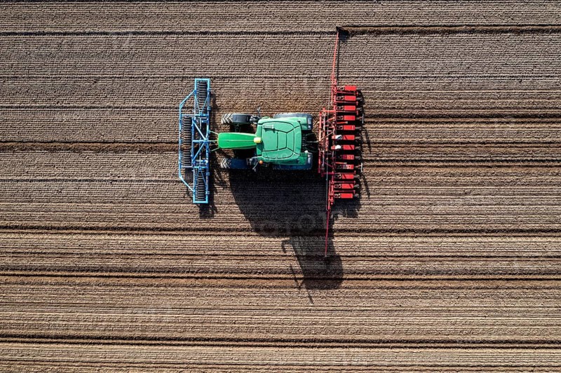 Sugar beet being sown in spring, precision sowing with precision seed drill, behind a tractor, Niederkrüchten, North Rhine-Westphalia, Germany, Europe