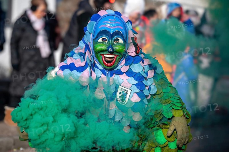 Hofener Scillamännle with smoke bomb at the big carnival parade, Hofen, Stuttgart, Baden-Württemberg