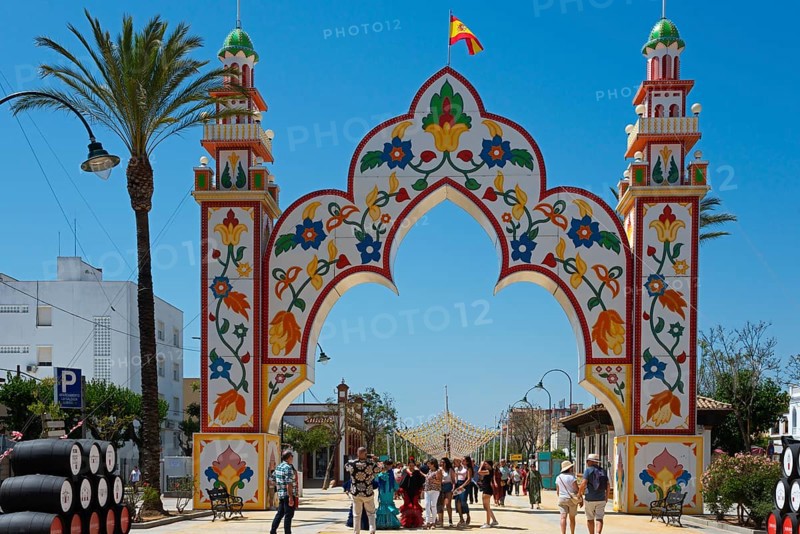 Decorative Tor tor with floral motifs and a crowd of people below, festive ambience, Feria de la Manzanilla, Feria de Sanlúcar, Sanlúcar de Barrameda, Sanlucar, Cádiz, Cadiz, Andalusia, Spain, Europe