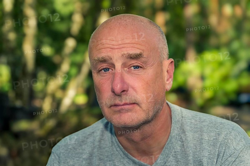 Portrait, man, camera view, sad, beard, unshaven, bald, background blurred, edge of forest, Storkow, Brandenburg, Germany, Europe