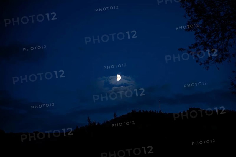 Moon over a range of hills, Mugel mountain, Leoben, Styria, Austria, Europe